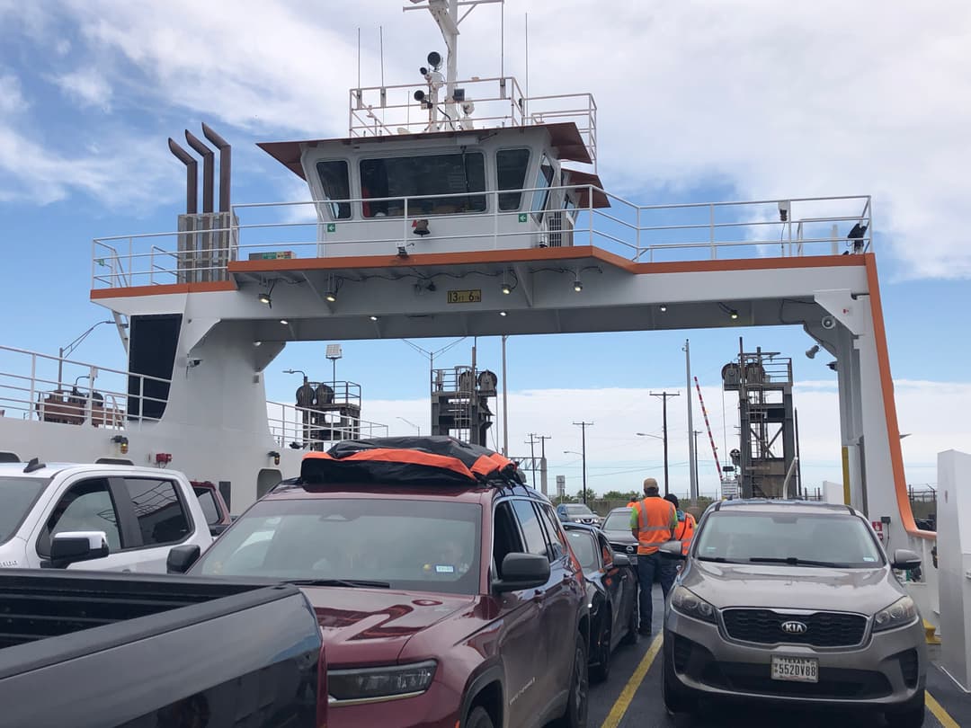 Ferry crossing to Port Aransas with pelicans and open water