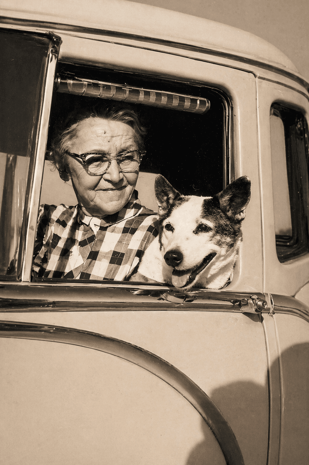 Connie Hagar smiling with her dog Patch leaning out the car window, Rockport Texas