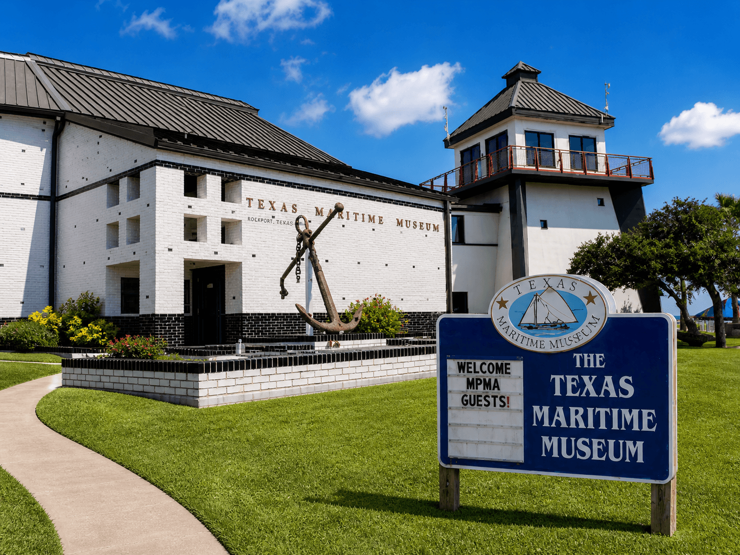 Texas Maritime Museum exterior with anchor sculpture and lighthouse tower