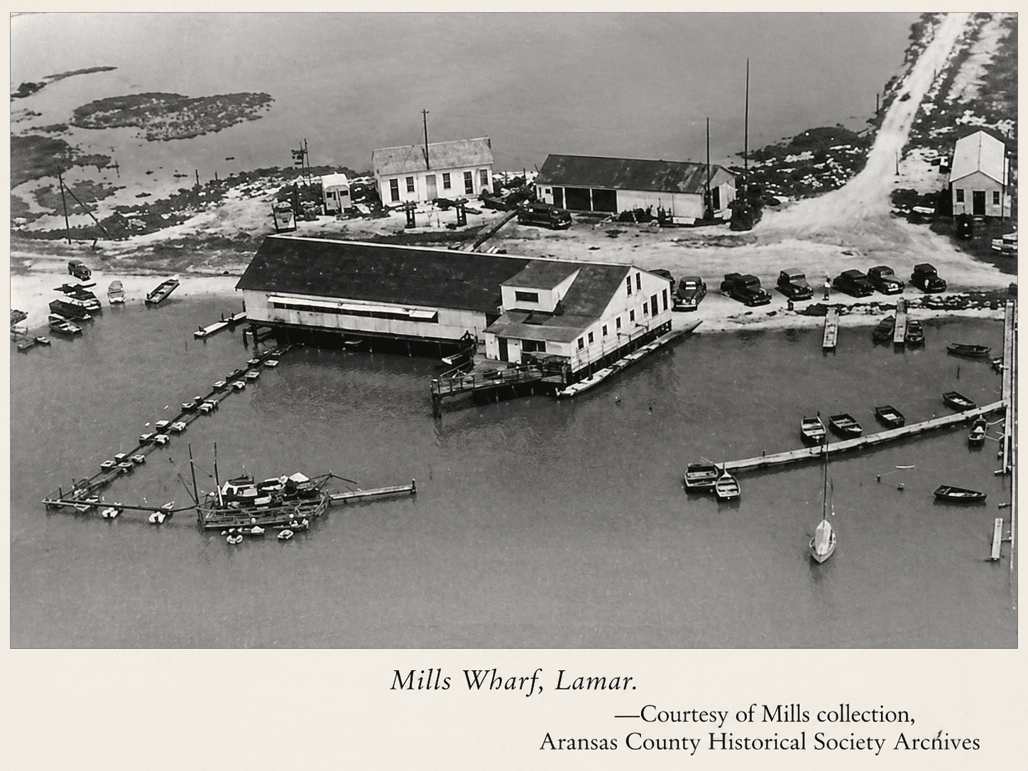 Aerial view of Mills Wharf Lamar Texas 1940s showing pier and fishing lodge on Aransas Bay