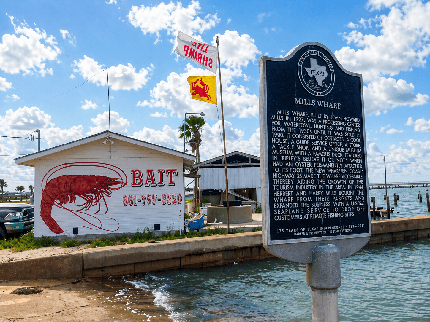 Mills Wharf Texas Historical Marker at Lamar with bait shop and Live Shrimp flag