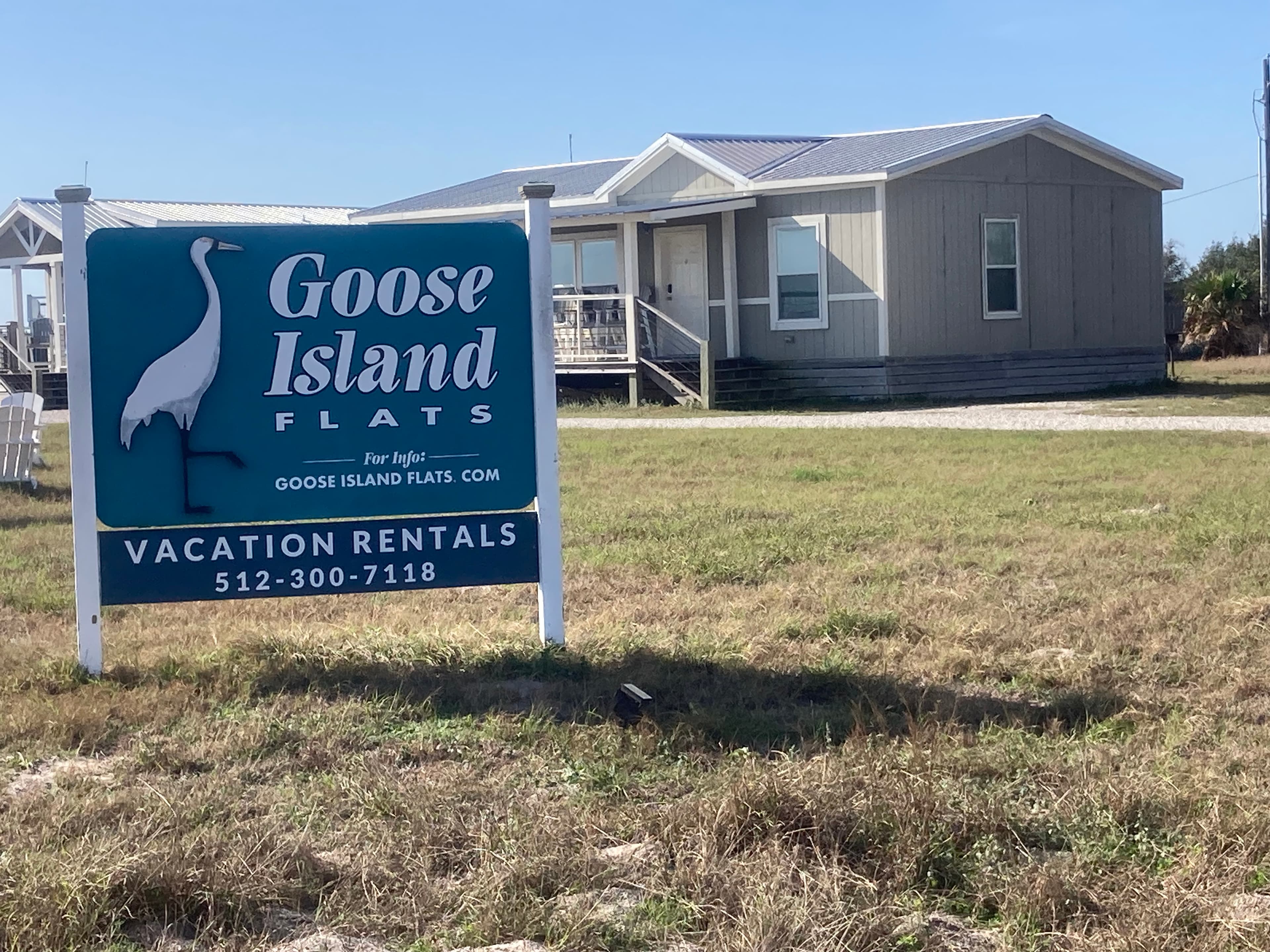 Cabins on the Lamar Peninsula overlooking the cow pond whooping crane feeding area — a rare bird's-eye view of the tide flats