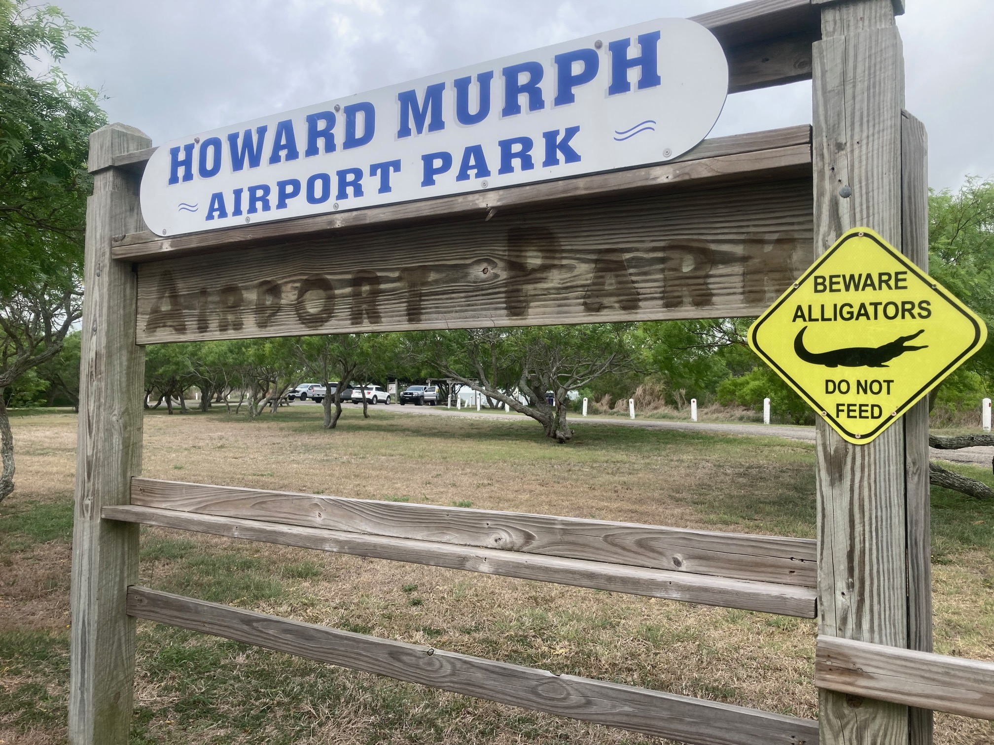 Howard Murph Airport Park entrance sign with Beware Alligators warning, Rockport TX